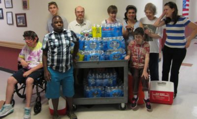 Gompers members proudly display water collected